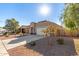 House with driveway, landscaping, and a wooden fence at 2455 E Alida Trl, Casa Grande, AZ 85194