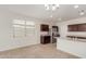 Bright kitchen nook area with a chandelier and large window at 2455 E Alida Trl, Casa Grande, AZ 85194