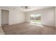 Spacious living room featuring a sliding glass door and neutral color palette at 2455 E Alida Trl, Casa Grande, AZ 85194