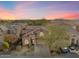 Two-story house with desert landscaping, driveway, and sunset in background at 2509 W Straight Arrow Ln, Phoenix, AZ 85085