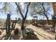 Large backyard with playset, cacti, and picnic table at 2509 W Straight Arrow Ln, Phoenix, AZ 85085