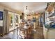 Kitchen with wood cabinets, tile floors, and a dining area at 2509 W Straight Arrow Ln, Phoenix, AZ 85085