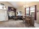 Living room features a southwestern theme with leather couches and a wood bar at 2509 W Straight Arrow Ln, Phoenix, AZ 85085