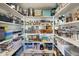 Well-organized pantry with ample shelving for storage at 2509 W Straight Arrow Ln, Phoenix, AZ 85085