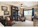 Cozy sitting room with comfortable chairs and bookcase at 2509 W Straight Arrow Ln, Phoenix, AZ 85085