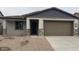 One-story home with neutral exterior and two-car garage at 25312 W Bowker St, Buckeye, AZ 85326