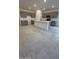 Modern kitchen with gray cabinets, island, and tile floors at 25312 W Bowker St, Buckeye, AZ 85326