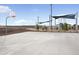 Community basketball court and shade-covered playground on a sunny day at 25318 W Bowker St, Buckeye, AZ 85326