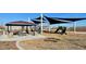 Community playground with shaded seating and play equipment at 25318 W Bowker St, Buckeye, AZ 85326