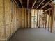 Unfinished bedroom with exposed wooden framing and concrete flooring at 26111 N 23Rd Ave, Phoenix, AZ 85085