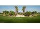 Community entrance with palm trees and a paved walkway at 26111 N 23Rd Ave, Phoenix, AZ 85085