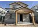 New construction two-story home with scaffolding shows front entry under construction at 26111 N 23Rd Ave, Phoenix, AZ 85085