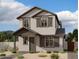 Two-story home with gray siding, dark brown accents, and landscaping at 26111 N 23Rd Ave, Phoenix, AZ 85085