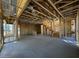 Unfinished living room with exposed wooden framing and concrete flooring at 26111 N 23Rd Ave, Phoenix, AZ 85085