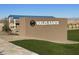 Wales Ranch community entrance with brick signage and covered seating at 2657 E Abe Truckle Ave, San Tan Valley, AZ 85140