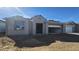 New construction home showing front elevation, gravel yard, and attached two-car garage at 2657 E Abe Truckle Ave, San Tan Valley, AZ 85140