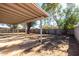 Large backyard with a covered patio and mature trees at 2905 W Stella Ln, Phoenix, AZ 85017