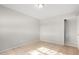 Simple bedroom featuring tile floors and an adjacent bathroom at 2905 W Stella Ln, Phoenix, AZ 85017