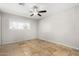 Spacious bedroom with tile floor and ceiling fan at 2905 W Stella Ln, Phoenix, AZ 85017