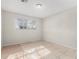 Simple bedroom with tile floors and a window at 2905 W Stella Ln, Phoenix, AZ 85017