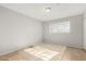 Bright bedroom with tile floors and a window allowing in natural light at 2905 W Stella Ln, Phoenix, AZ 85017