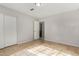 Well-lit bedroom with tile floors and closet at 2905 W Stella Ln, Phoenix, AZ 85017