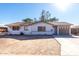 Ranch-style home with a large yard and a two-car garage at 2905 W Stella Ln, Phoenix, AZ 85017