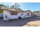 White ranch home with mature landscaping and a garage at 2905 W Stella Ln, Phoenix, AZ 85017