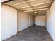 Attached garage with an overhead door and extra space at 2905 W Stella Ln, Phoenix, AZ 85017