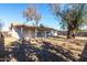 Back exterior of house showing patio and yard at 2905 W Stella Ln, Phoenix, AZ 85017