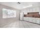 Bright kitchen with white cabinets and tile flooring at 2905 W Stella Ln, Phoenix, AZ 85017