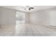 Living room with tile floors, sliding doors and ceiling fan at 2905 W Stella Ln, Phoenix, AZ 85017