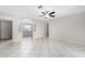 Bright living room with tile floors and a ceiling fan at 2905 W Stella Ln, Phoenix, AZ 85017