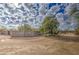 Partial view of a property with a large fenced area and a dirt road at 29619 N 60Th St, Cave Creek, AZ 85331