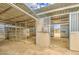 View of horse stalls with a fan and wood shavings at 29619 N 60Th St, Cave Creek, AZ 85331