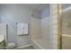 Clean bathroom with a shower/tub combo and neutral tile at 29619 N 60Th St, Cave Creek, AZ 85331