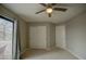 Bedroom with double closets and sliding glass door at 29619 N 60Th St, Cave Creek, AZ 85331