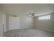 Bright bedroom with double doors and a glass block window at 29619 N 60Th St, Cave Creek, AZ 85331