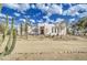 White stucco house with desert landscaping and a spacious front yard at 29619 N 60Th St, Cave Creek, AZ 85331