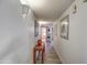 Bright hallway with wood accent table and artwork at 29619 N 60Th St, Cave Creek, AZ 85331