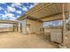 View of rustic horse stables with covered stalls and outdoor storage at 29619 N 60Th St, Cave Creek, AZ 85331