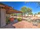 Inviting brick patio with pergola, offering a shaded area for outdoor relaxation at 29619 N 60Th St, Cave Creek, AZ 85331