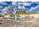 Inviting kidney-shaped pool surrounded by a stone patio and lush landscaping at 29619 N 60Th St, Cave Creek, AZ 85331