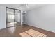 Bright bedroom with mirrored closet doors and wood-look tile floors at 3033 E Devonshire Ave # 1037, Phoenix, AZ 85016