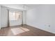 Well-lit bedroom featuring wood-look tile floors and window coverings at 3033 E Devonshire Ave # 1037, Phoenix, AZ 85016