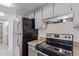 Kitchen with granite countertops and stainless steel appliances at 3033 E Devonshire Ave # 1037, Phoenix, AZ 85016