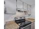 Kitchen with granite countertops and stainless steel range at 3033 E Devonshire Ave # 1037, Phoenix, AZ 85016