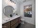 Modern bathroom with a floating vanity, large mirror, and stylish lighting at 3077 W Ironwood Cir, Chandler, AZ 85226