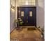 Elegant entryway with double doors and terracotta tile flooring at 3077 W Ironwood Cir, Chandler, AZ 85226