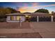 Stunning curb appeal of this single-story home, featuring a two-car garage and landscaped yard at 3077 W Ironwood Cir, Chandler, AZ 85226